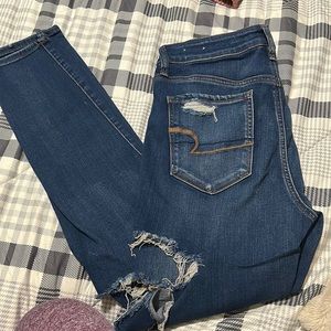 Women’s dark washed ripped jeans